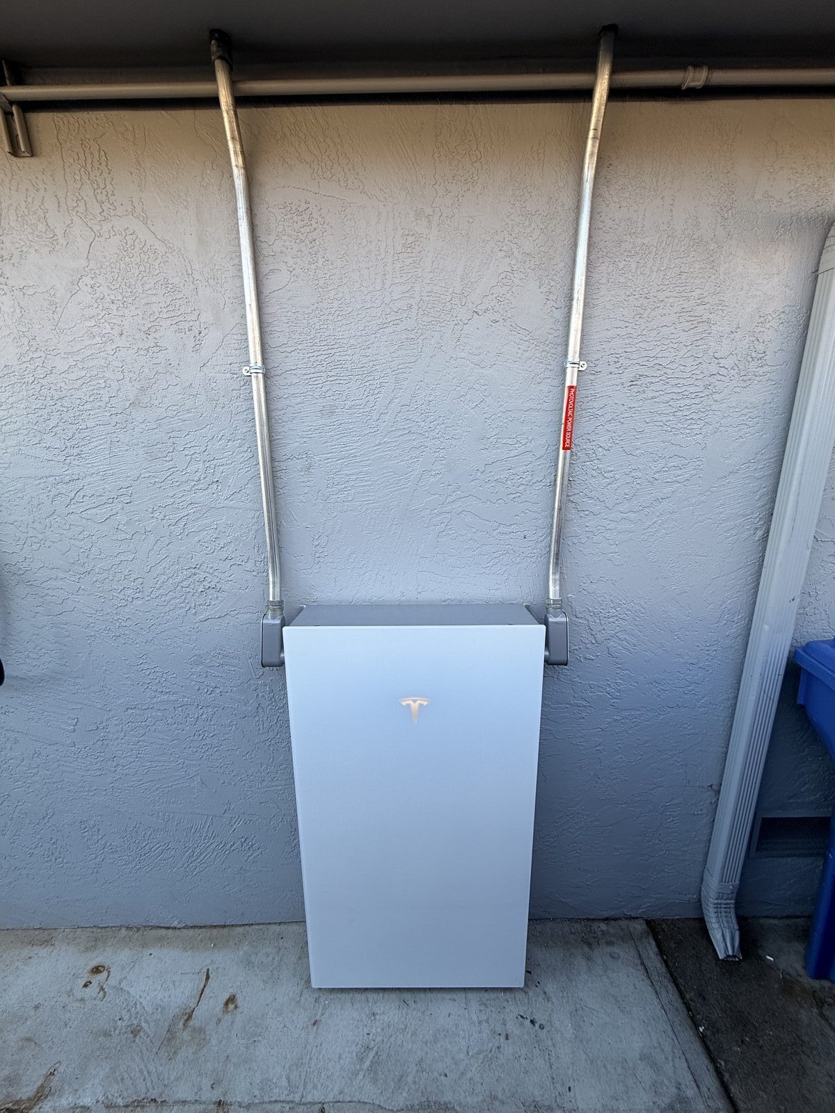Tesla Powerwall 3 installed on exterior stucco wall with conduit runs — Cyber Electric LLC, Fremont CA