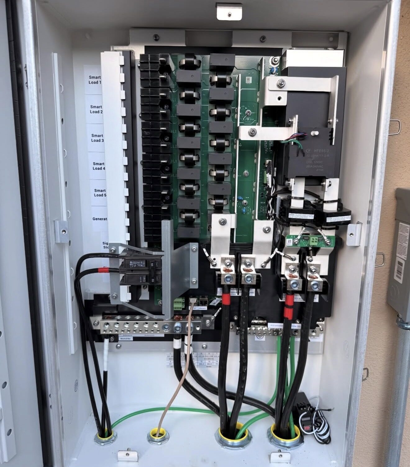 Sigen Load Hub interior — smart breakers and conductor terminations — Cyber Electric LLC